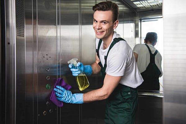 young-cleaning-company-worker-cleaning-elevator-and-smiling-at-camera.jpg young-cleaning-company-worker-cleaning-elevator-and-smiling-at-camera.jpg
